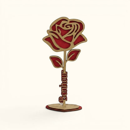 Rose décorative en bois peinte à la main par L'Atelier de Lylou, rouge et dorée, avec le mot "Bonheur" gravé sur la tige.