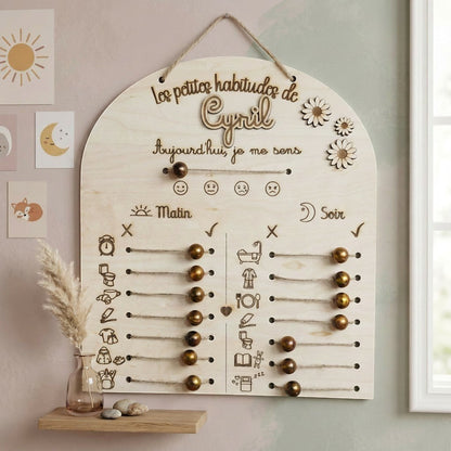 Tableau de routines personnalisé en bois L'Atelier de Lylou avec curseurs pour suivre les habitudes du matin et du soir, et indiquer l'humeur.
