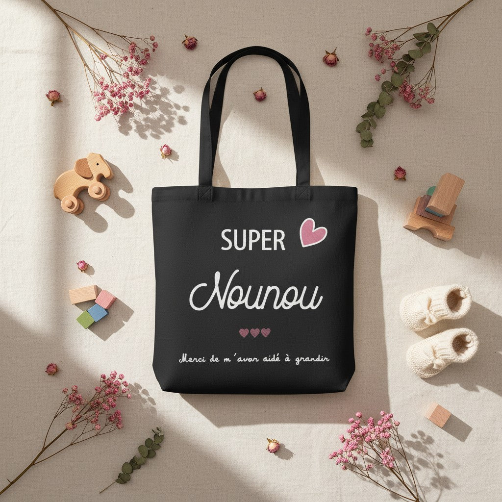 Tote-bag noir en coton L'Atelier de Lylou avec inscription "Super Nounou" et cœurs roses, cadeau pour nounou.
